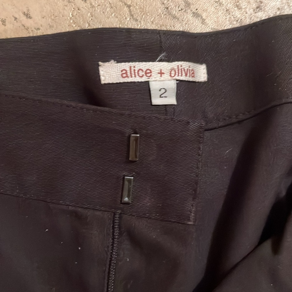 Alice & Olivia black cutout flare pants. Beautiful stylish and timeless. - Picture 2 of 5